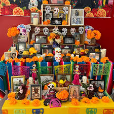 Beauty in Death: The Offrenda found in Solano was decorated in beautiful oranges and vibrant pinks and blues, set up to honor the deceased.