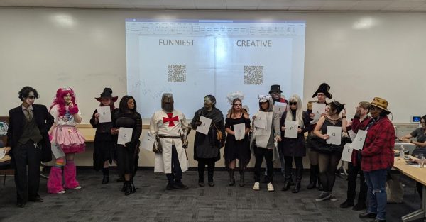 Both categories gathered around while other attendees voted for "Funniest" and "Most Creative" categories at the Solano College Library's Halloween Contest Oct 31, 2024.