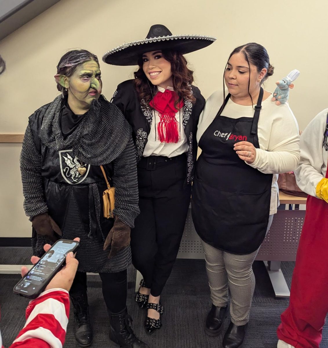 Mackenzie Ashby, Ariana Martinez, and others gather around for a photo after the Halloween Contest on Oct 31, 2024.