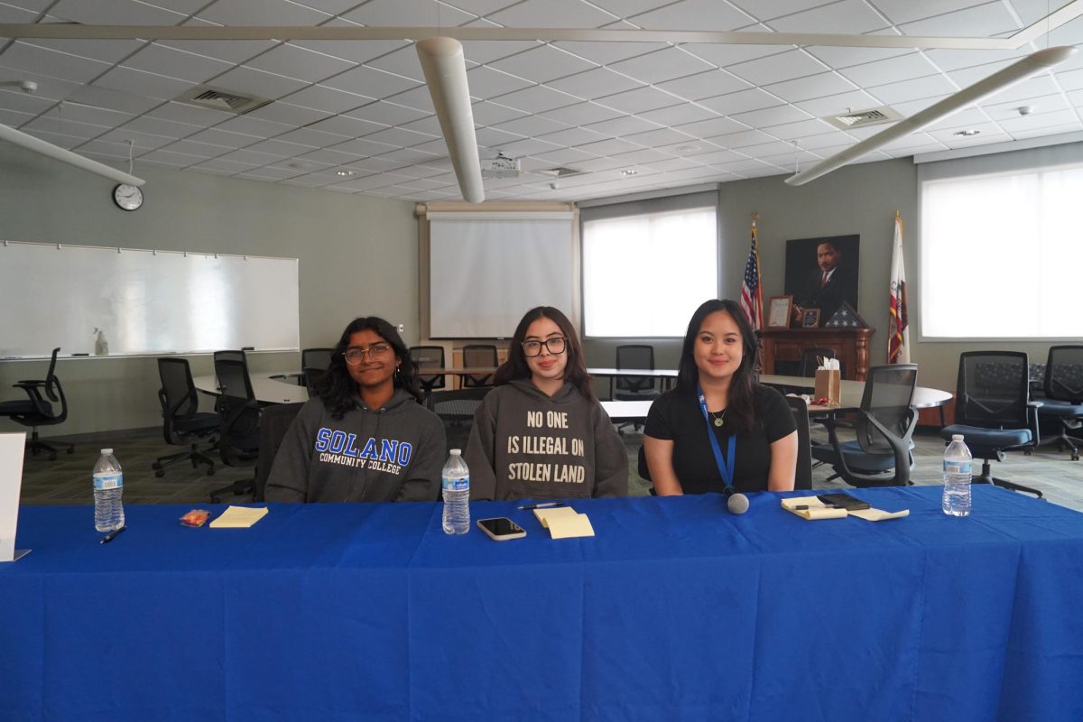 Sriya Srinivasan, Veronica Rodriguez, and Angelika Gallejo-Duculan pictured sitting at the ASSC open forum with candidates.