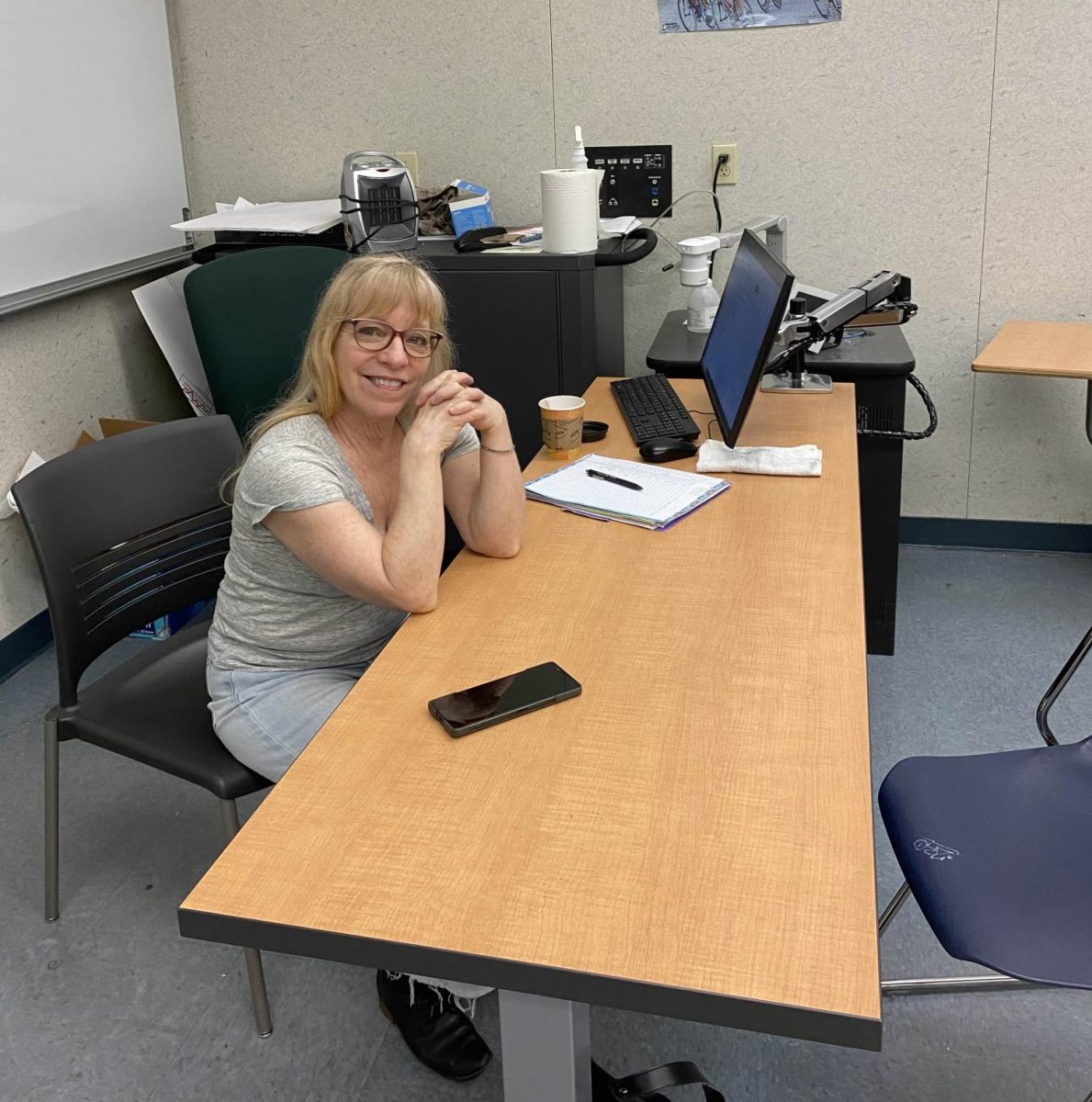 Chatty and Cheerful: Janene Whitesell sits at her Communications One desk. Whitesell is about to retire after teaching at the college for 37 years.