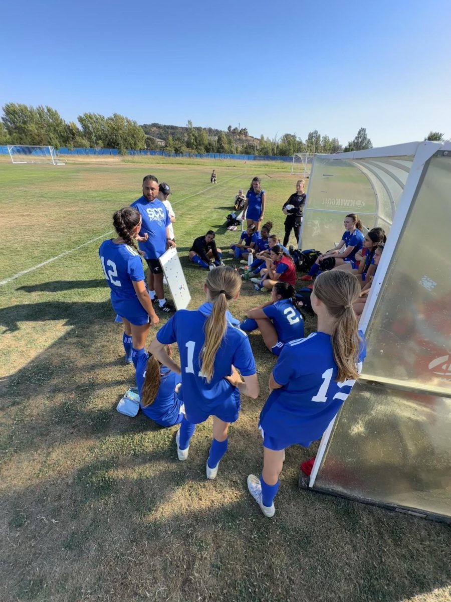 Team huddle at HT lead by Coach Alonso and Assistant Coach Peter