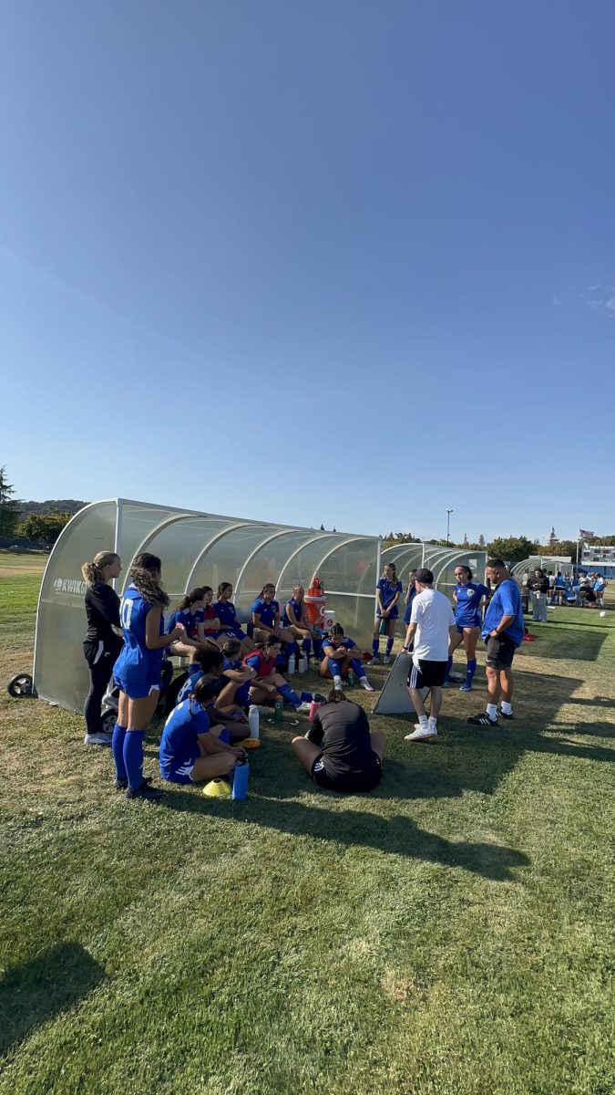 Team huddle at HT lead by Coach Alonso