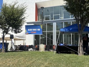 The DJ playing old school music in front of the Solano College Theatre and the Solano families.