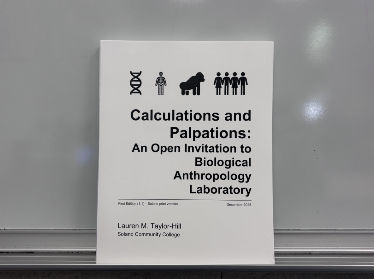 Professor Taylor-Hill's self-written textbook in a classroom