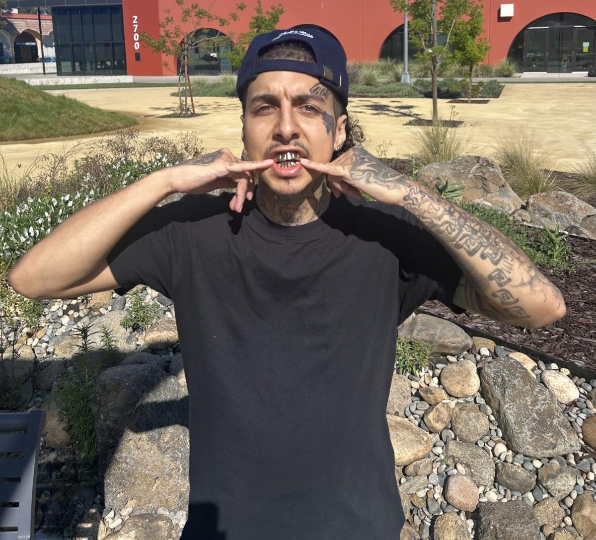 DaRosa flaunts his top and bottom gold grills in the Solano quad, April 6, 2026.