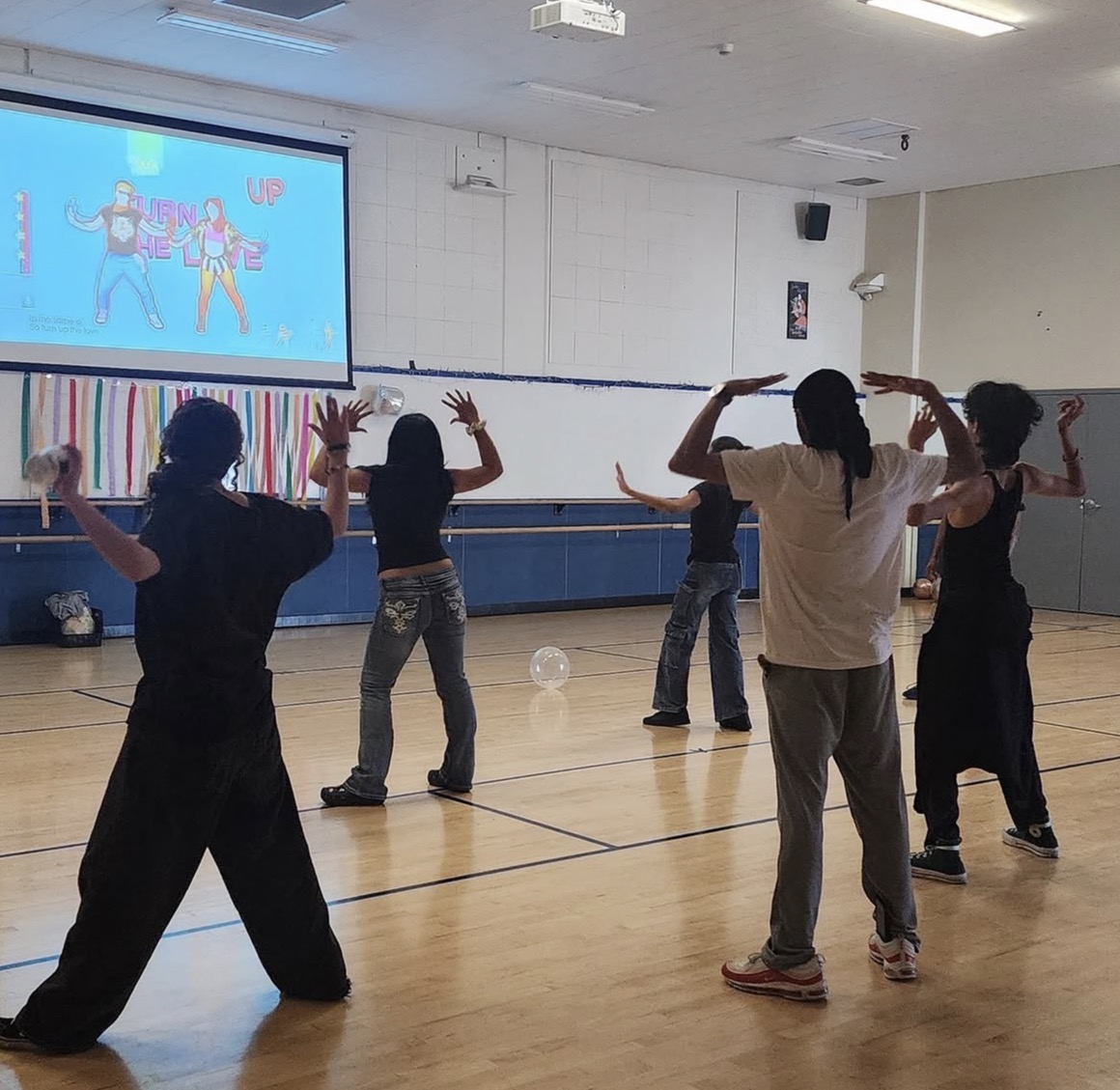 Attendees dancing along in the Solano Gymnasium during the Just Dance event. April 9, 2026.