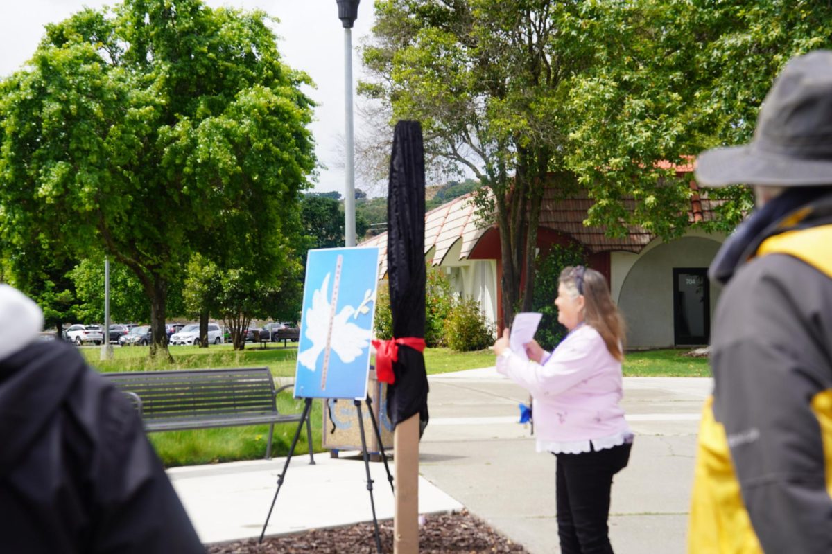 Ethnic Minority Coalition and Student Equity Council Member Terri Martin giving her brief introduction on establishing the Peace Pole in front of the Quad April 22 , 2026