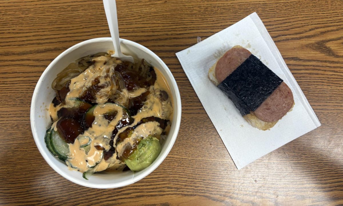 A beef bulgogi bowl and a spam musubi from Cafe Luma sit together on a desk
